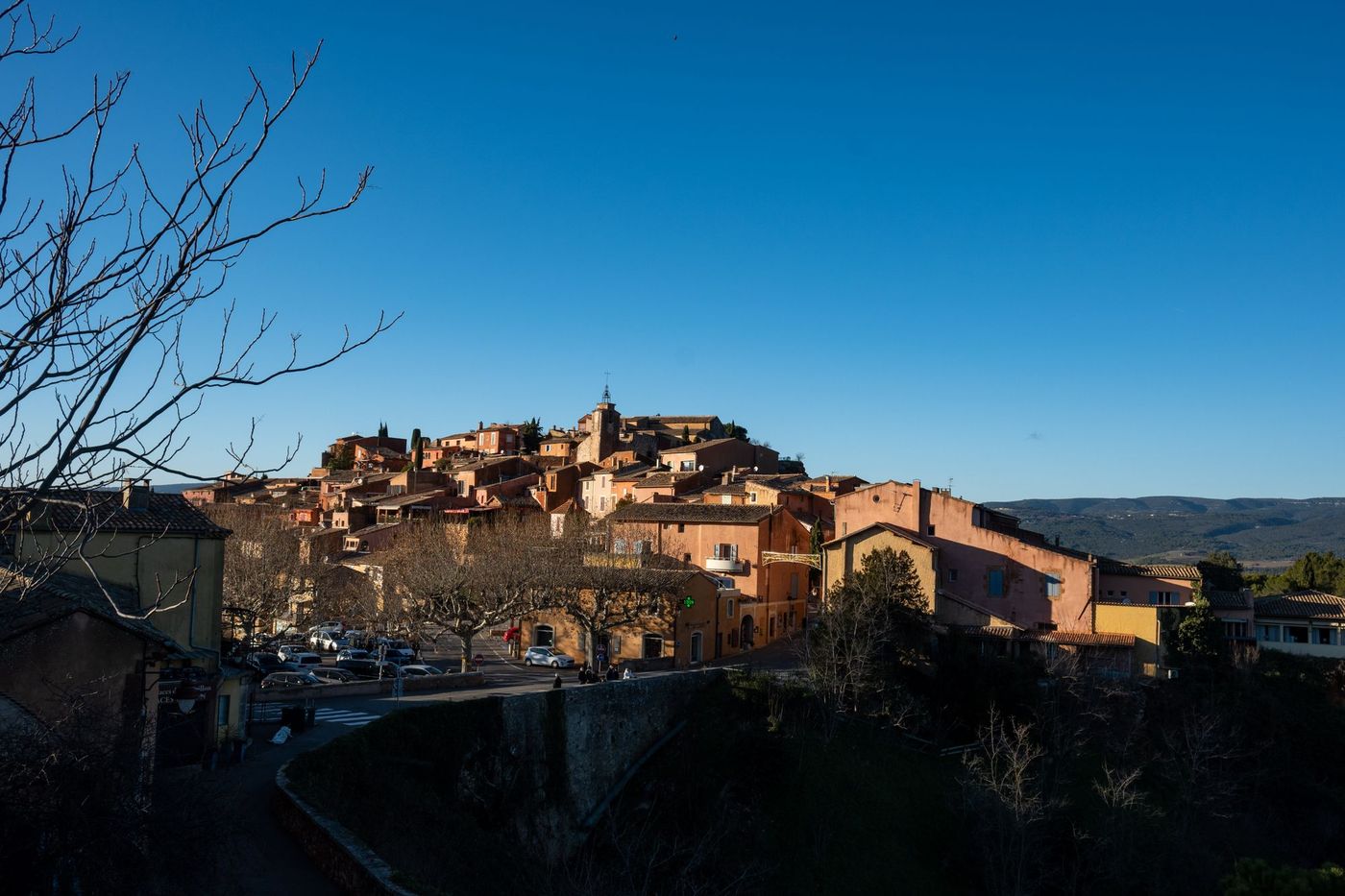 Ochre-coloured houses of Roussillon village in Provence at dusk
